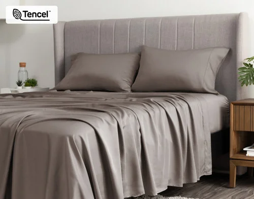 Angled view of a queen bed dressed in our BeechBliss TENCEL™ Modal Sheet Set in Bark.