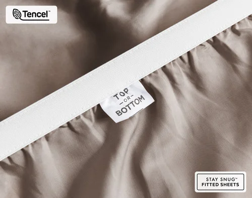 Close-up of Top & Bottom tag on the elastic of our BeechBliss TENCEL™ Modal Fitted Sheet in Bark.