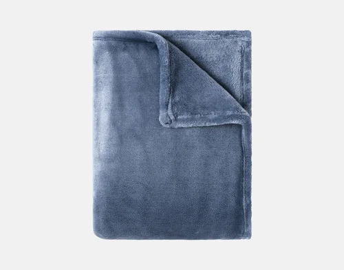 Our Velvet Plush Throw in Deep Wave folded neatly into a tidy square.