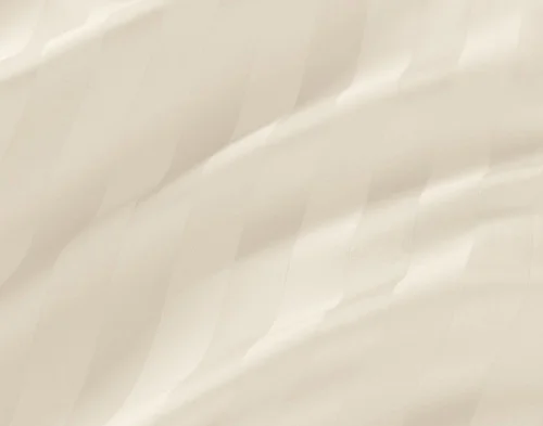 Close view of the striped pattern and soft, lustrous surface on our Cream Luxor Egyptian Cotton Sheet Set.