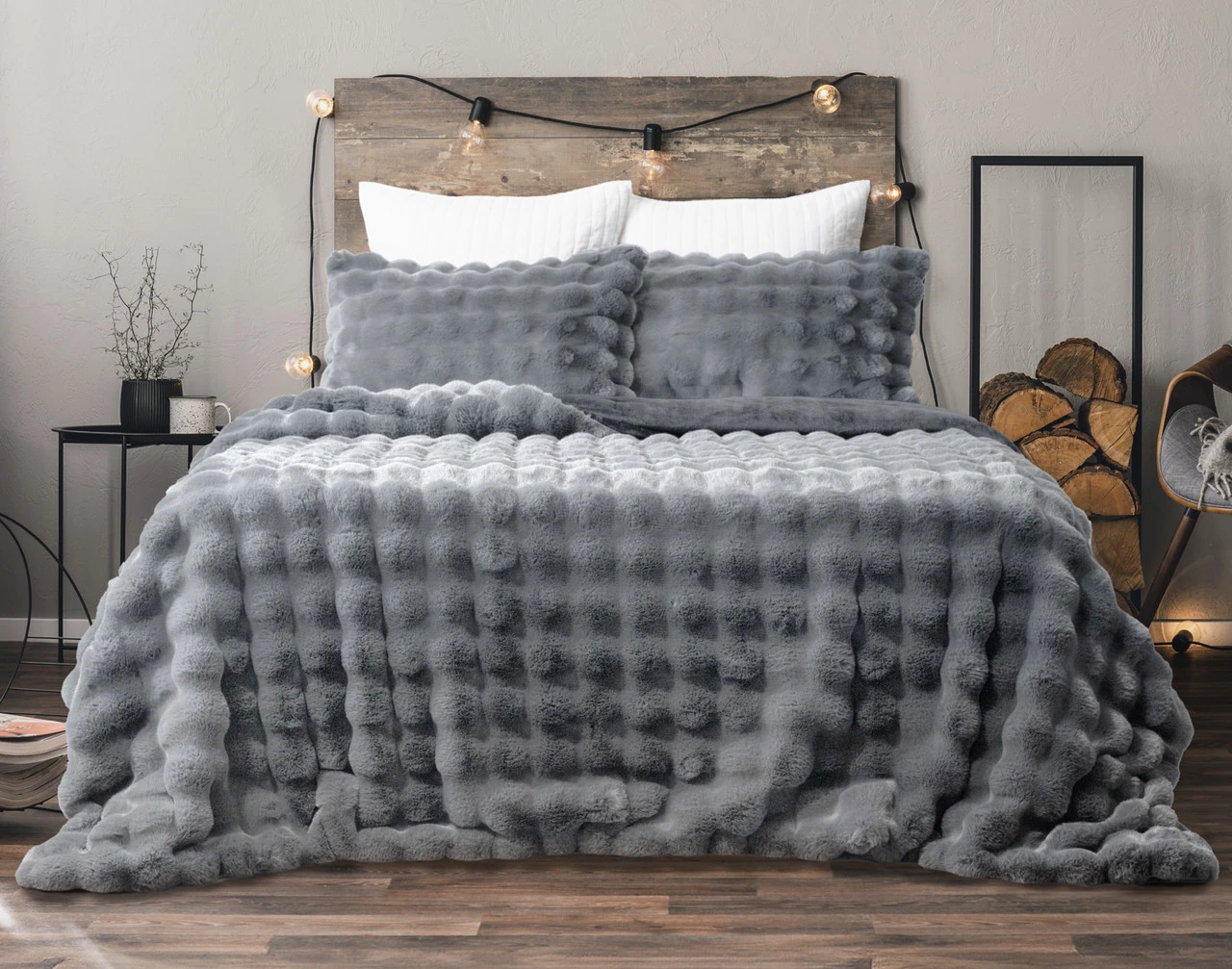 Front view of our Granite Bubble Faux Fur Comforter Set dressed on a cabin-style queen bed.