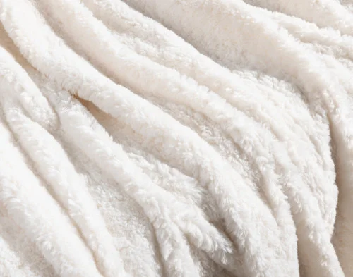 Close-up of the soft surface on our Ivory Poodle Faux Fur Throw.