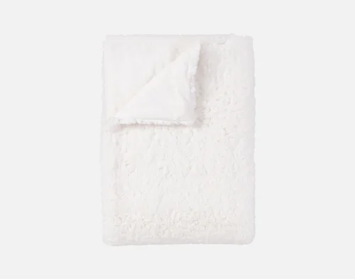Our Ivory Poodle Faux Fur Throw neatly folded.
