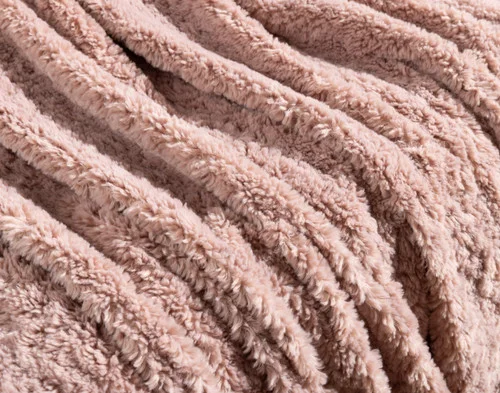 Close-up of the soft surface on our Dusty Rose Poodle Faux Fur Throw.
