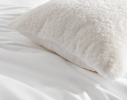 Close-up of the corners and edge on our Ivory Poodle Faux Fur Euro Sham.