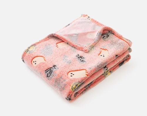 Our Boo & Bones Glow in the Dark Fleece Throw folded into a tidy square.
