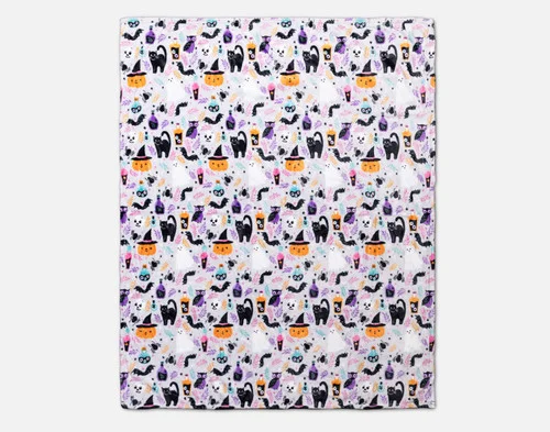 Folded view of our Midnight Mischief Halloween Fleece Throw over a white ground.