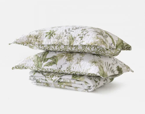 The contents of our Verdelle Cotton Quilt Set folded in a pile.