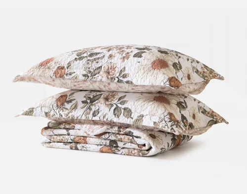 The full contents of our Carmine Cotton Quilt Set folded on a white background.