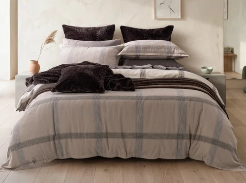Front view of our Bowen Duvet Cover Set dressing a queen bed with accessories.