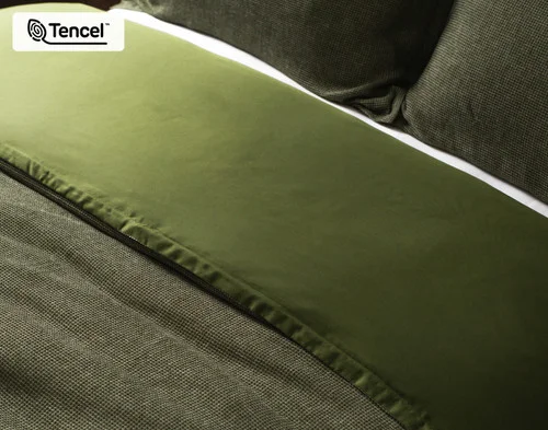 Close up on the folded surface of our Greenwood Duvet Cover, showing the front and reverse sides.