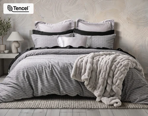 Front view of our Metric Duvet Cover dressed with accessories in a beige room.