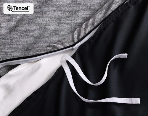 Close up view of a tie at the opening of our Metric Duvet Cover.