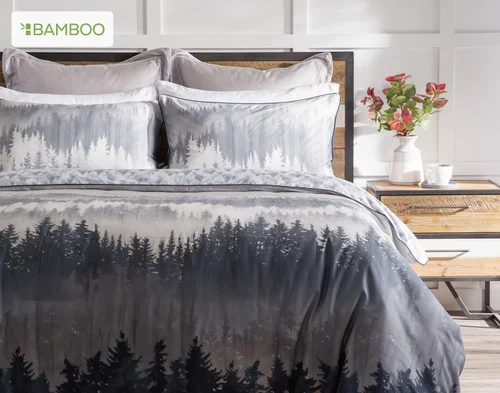 Front, off-centre view of our Mountainscape Duvet Cover dressing a queen bed in a simple room.