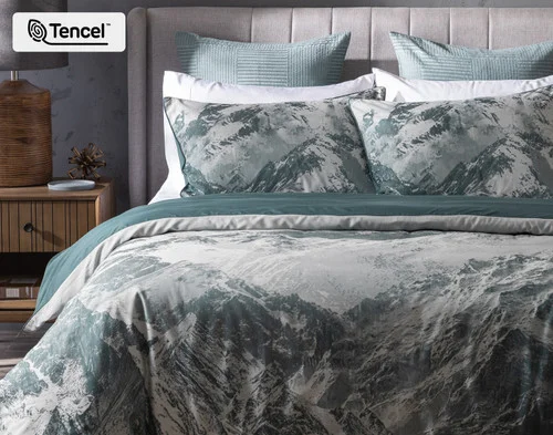 Front, off-centre view of our Skyline Duvet Cover dressing a queen bed.