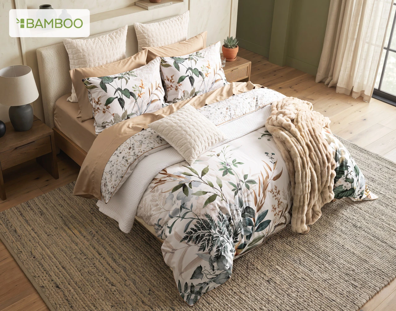 Angled, top-down view of our Cabot Duvet Cover dressing a queen bed with accessories.