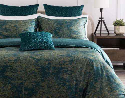 Front, off-centre view of our Elwood Duvet Cover dressing a queen bed with accessories.