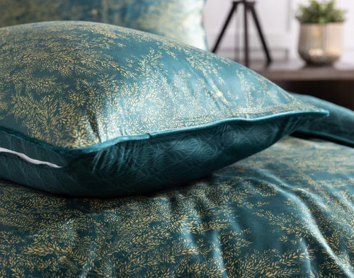Our Elwood Pillow Sham resting atop its duvet cover.