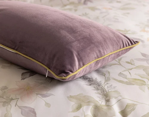 Our Elodie Boudoir Pillow Cover resting atop our Elodie Duvet Cover.