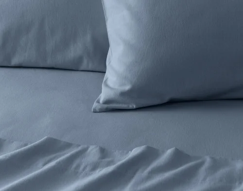 Close-up on the corner of a pillowcase from our Arctic Slate Flannel Sheet Set.