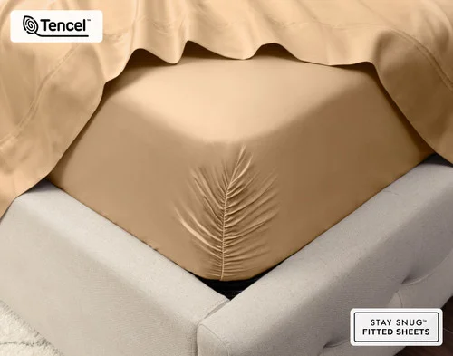 Close-up on the corner of our Eucalyptus Luxe Sheet Set in Sandalwood fit over a queen mattress.