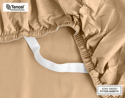 Close-up on the elastic snug fit band on the corner of our Eucalyptus Luxe Fitted Sheet in Sandalwood.