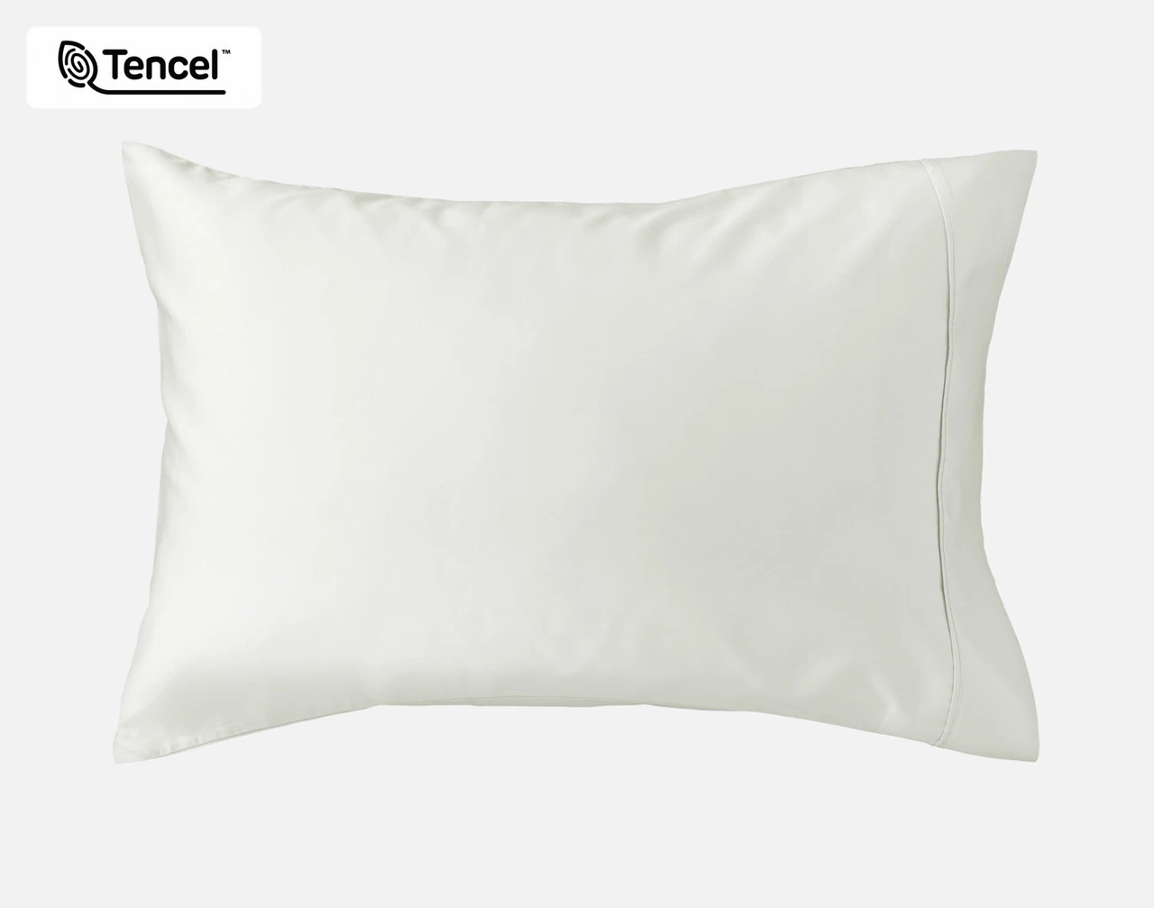 Angled view of our Eucalyptus Luxe Pillowcases in Oyster sitting against a headboard of a beige queen bed.