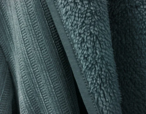 Close-up of the fabric on our Chenille Sherpa Bathrobe in Juniper to show both its sherpa lining and chenille surface.