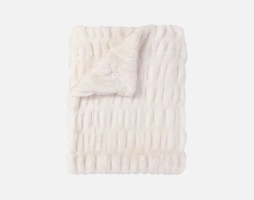 Our Cocoon Plush Throw in Cream folded into a rectangle against a white background.