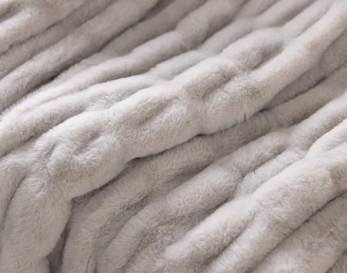 Close up on our Cocoon Plush Throw in Silver to show its textured surface.