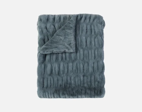 Our Cocoon Plush Throw in Juniper folded into a rectangle against a white background.