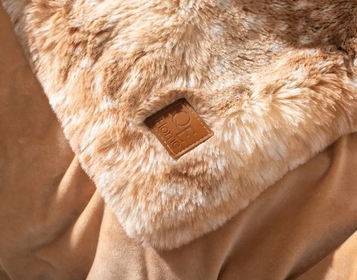 Close up on the corner of our Animal Faux Fur Throw - Fawn.