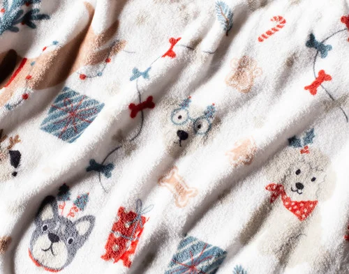 Close up on our Holiday Fleece Throw - Cozy Canines.