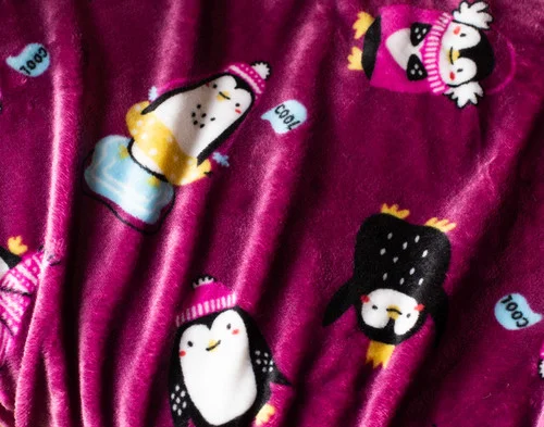 Close up on our Holiday Fleece Throw - Winter Waddle.