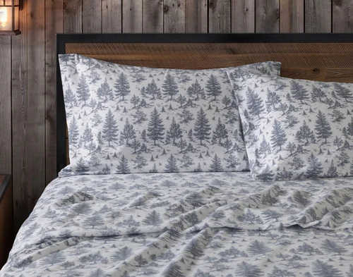 Front view of two pillowcases from our Winter Toile Organic Cotton Flannel Sheet Set resting against a headboard.