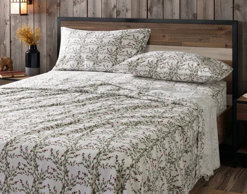 Our Rosehip Grove Organic Cotton Flannel Sheet Set dressed over a plain queen bed.