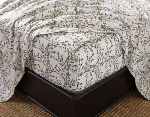Close-up of the fitted sheet from our Rosehip Grove Organic Cotton Flannel Sheet Set fitted over a mattress.