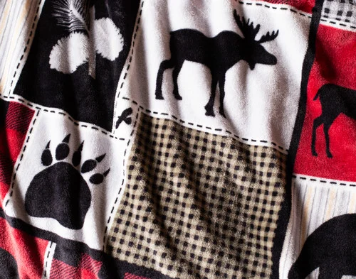 Close up on our Holiday Fleece Throw - Cabin Comfort.