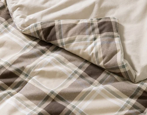 Close-up on the folded corner of our Timberline Cotton Flannel Comforter Set to show its smooth velvet backing.