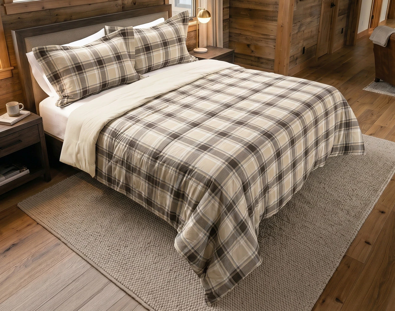 Angled view of our Timberline Cotton Flannel Comforter Set dressed over a queen bed in a cabin bedroom.