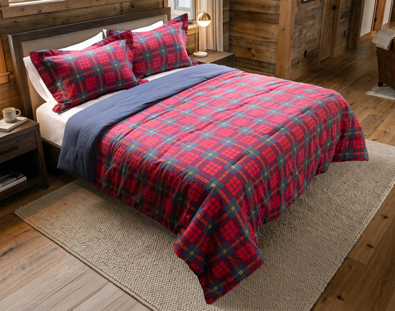 Angled view of our Bramble Ridge Cotton Flannel Comforter Set dressed over a queen bed in a cabin bedroom.