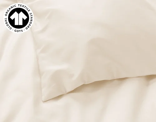 Close-up on the corner of our Undyed & Unbleached Organic Cotton Duvet Cover.