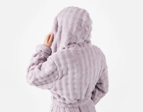 Back view of our Sage Mini Bubble Hooded Bathrobe being worn.