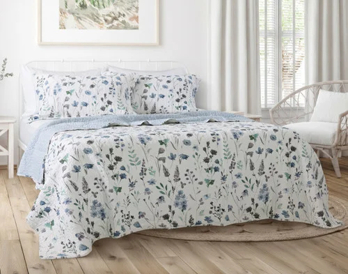 Front view of our Linnea Cotton Quilt Set in a brightly lit bedroom.