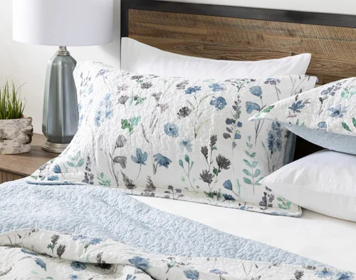 Front view of the pillow shams from our Linnea Cotton Quilt Set sitting against a headboard.