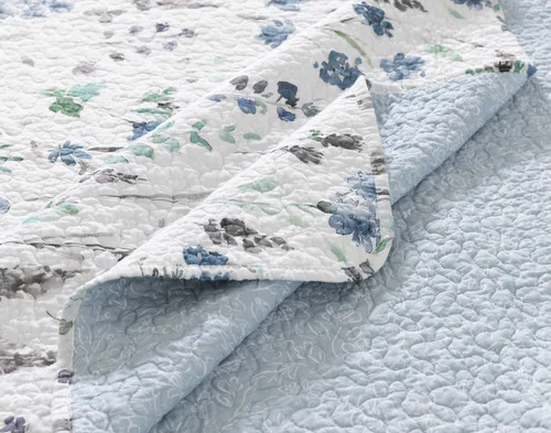 Close-up of the surface and reverse on the corner of our Linnea Cotton Quilt Set.