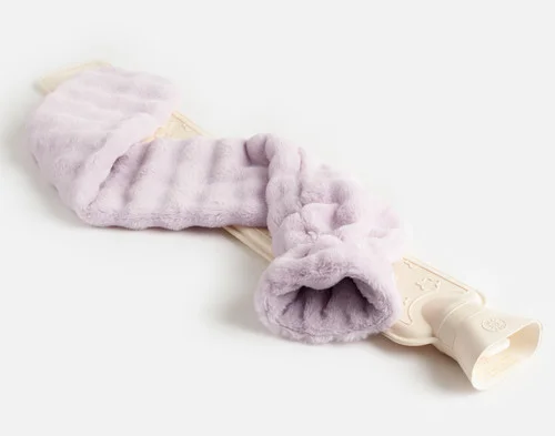 Angled view of the removed cover and rubber water bottle insert from our Lilac Dusk Mini Bubble Lumbar Hot Water Bottle.