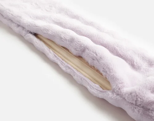 Close view of the zipper enclosure on the faux fur cover of our Lilac Dusk Mini Bubble Lumbar Hot Water Bottle.
