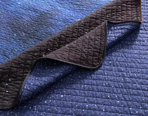 Close-up of the folded corner on our Starfield Cotton Quilt Set.