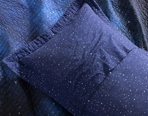 Reverse view of the envelope enclosure on a pillow sham from our Starfield Cotton Quilt Set.